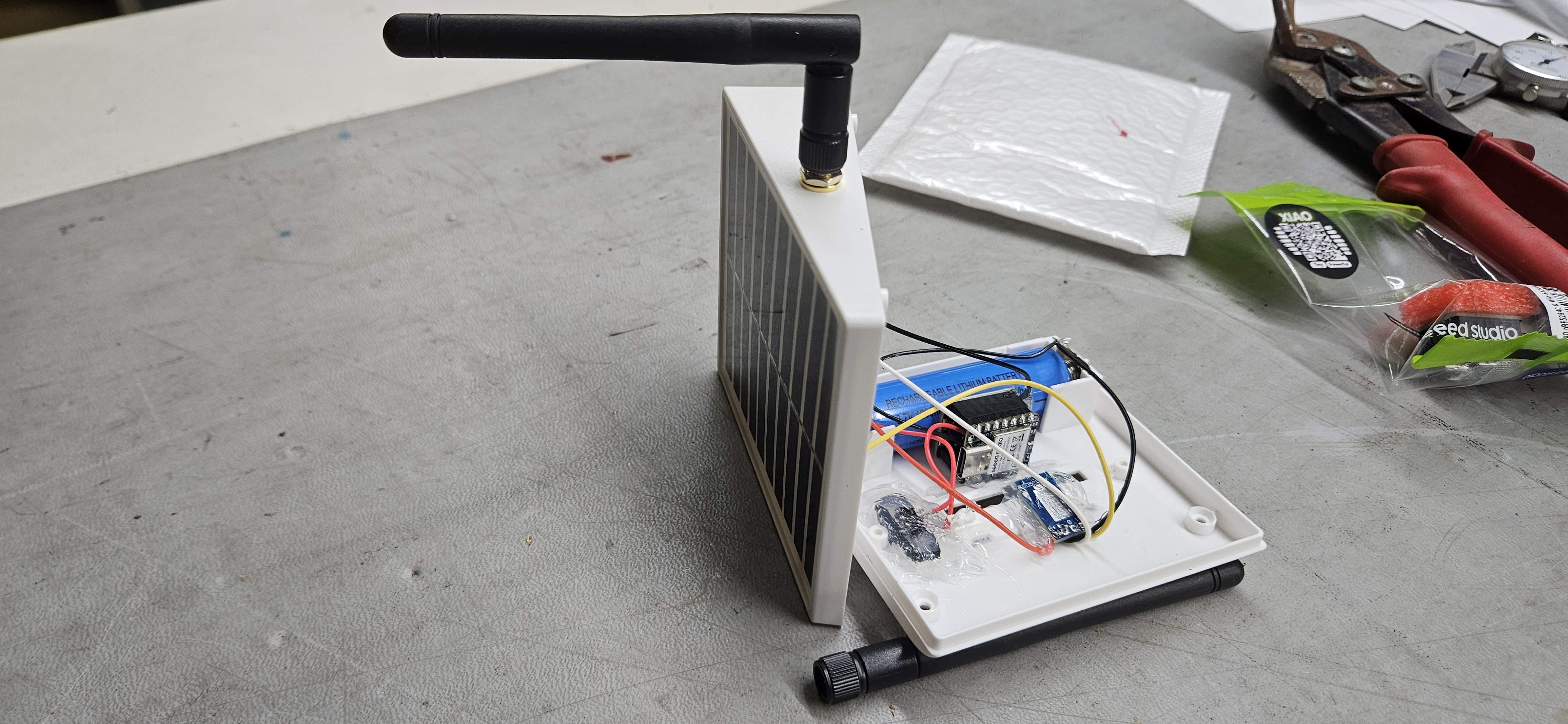 Assembled solar gutter light repeater with right-angle Muzi whip antenna attached